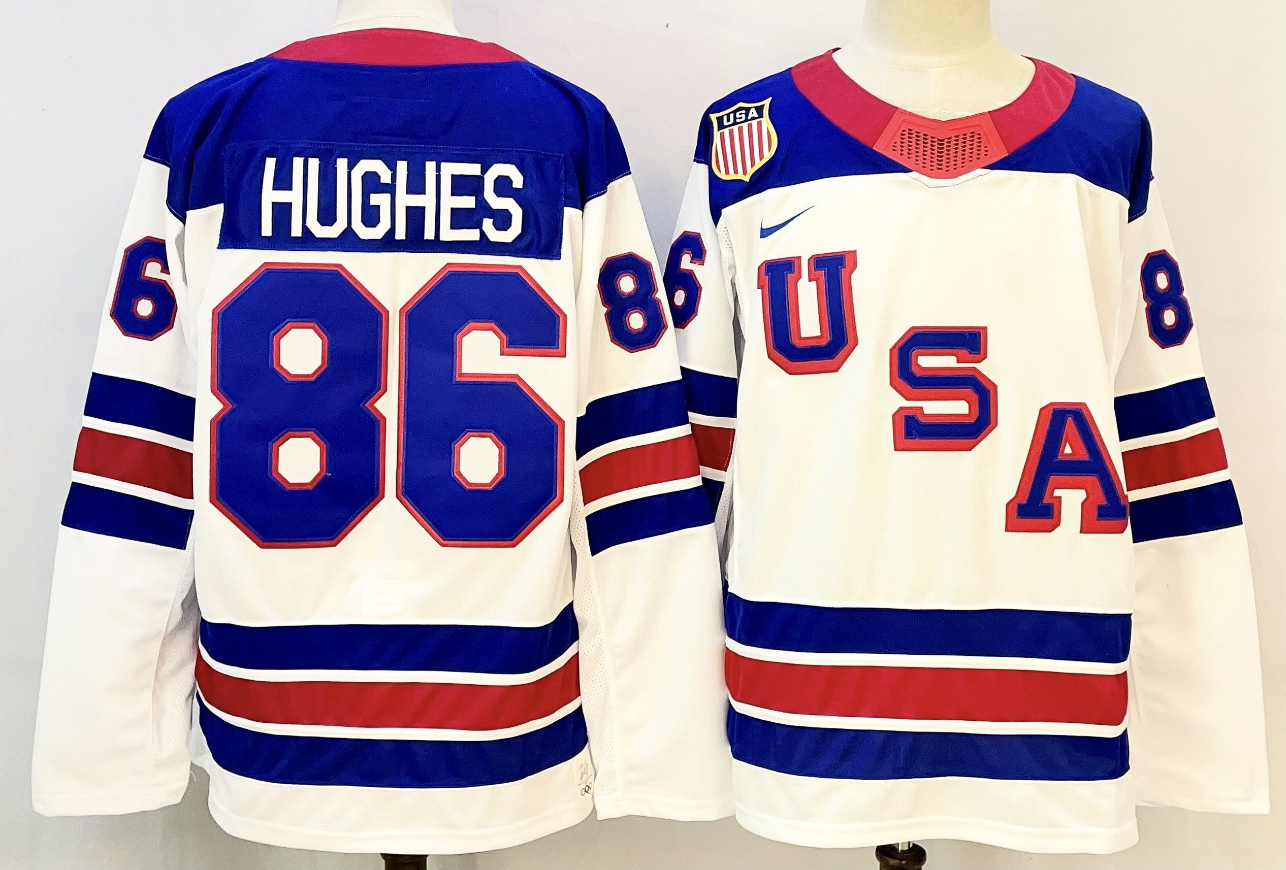 Men USA #86 Hughes White Nike 2026 NHL jersey 01